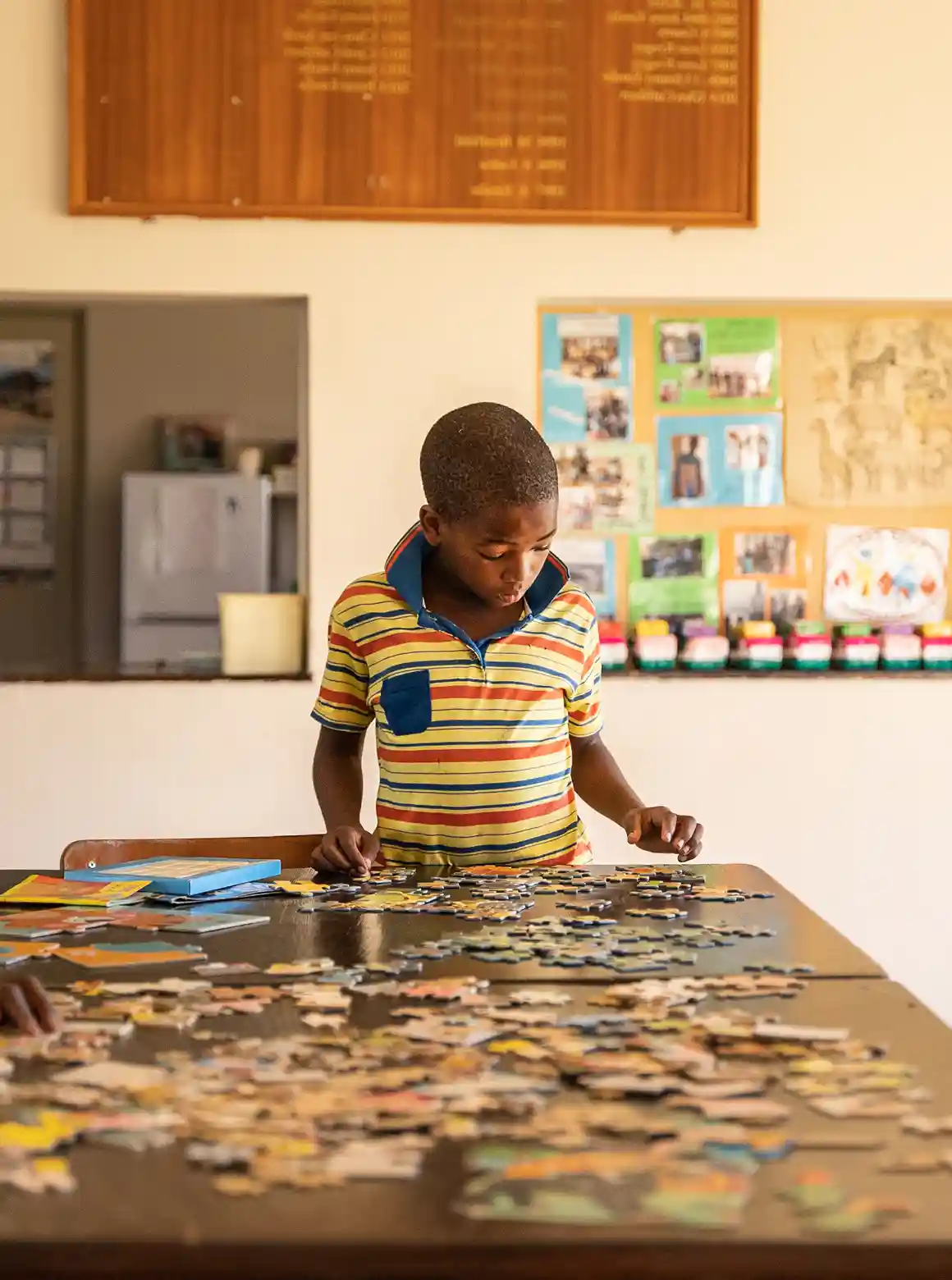 young child building a puzzle
